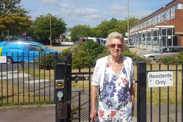 Betty Cook outside the gate at Harbour Tower that knocked her over and broke her pelvisPicture: Will Rooney