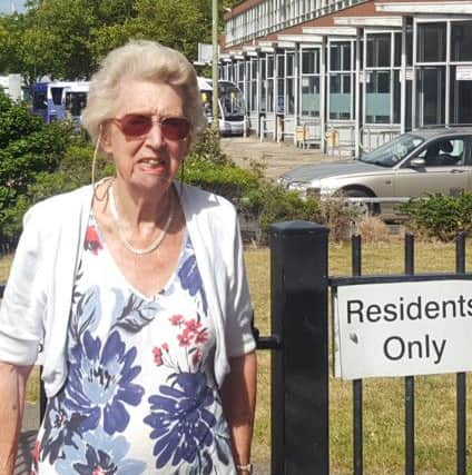 Betty Cook outside the gate at Harbour Tower that knocked her over and broke her pelvis                               Picture: Will Rooney