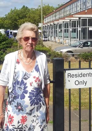 Betty Cook outside the gate at Harbour Tower that knocked her over and broke her pelvis                               

Picture: Will Rooney
