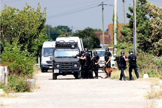 Police at the scene of the armed siege in Pagham Picture: UKNIP