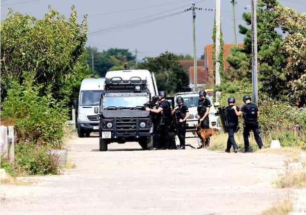 Police at the scene of the armed siege in Pagham Picture: UKNIP