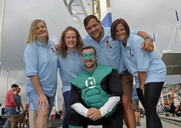 Supporters and family friends of Charlie Harris who has leukaemia get ready to abseil at The Spinnaker Tower to raise money for his charity. (left to right), Claire Henry, Carly Cooper, Mark and Nikki Knoll-Pollard with front Ian Arbuckle.
Picture Ian Hargreaves (161205-3)