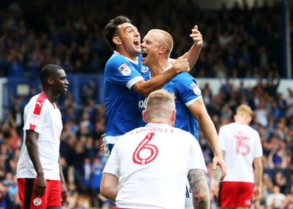 Pompey goalscorers Gary Roberts, left, and Curtis Main celebrate after the latter's opener in today's 3-0 win over Crawley Town Picture: Joe Pepler