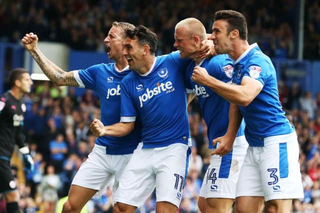 From left: Carl Baker, Gary Roberts, Curtis Main and Enda Stevens celebrate as Pompey run riot in the first-half at Fratton Park Picture: Joe Pepler