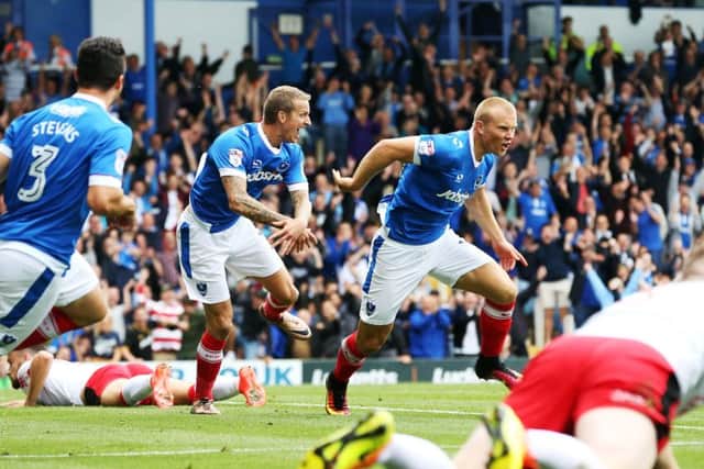 Curtis Main celebrates after opening the scoring in Pompey's 3-0 win over Crawley Town at Fratton Park Picture: Joe Pepler