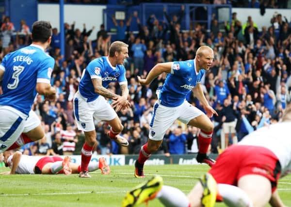 Curtis Main celebrates after opening the scoring in Pompey's 3-0 win over Crawley Town at Fratton Park    Picture: Joe Pepler