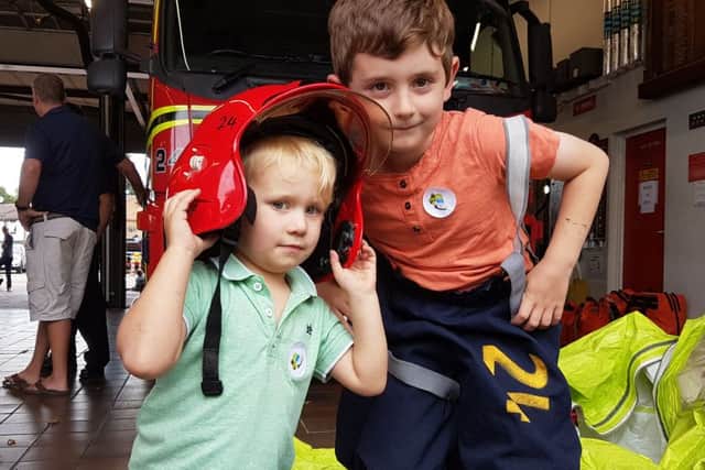 Southsea Fire Station open day, held on September 3
Cousins Monty Jarvis, three, and Owen Duncan, seven, from Southsea, trying on some kit PPP-160309-180137001