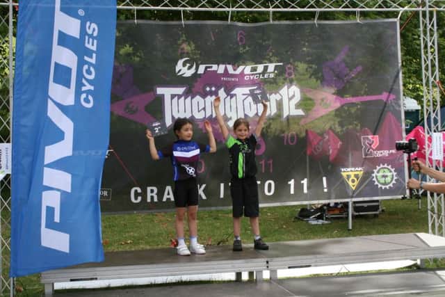 Edith Price, left, on the podium