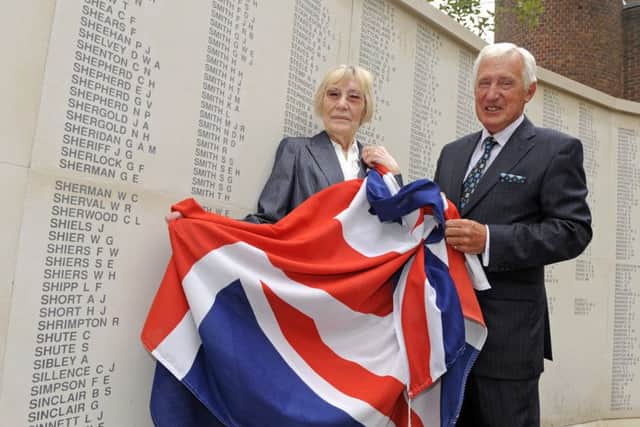 Colin Barrell and Jean Louth with Jean's late father's name H.J.Short on the memorial Picture:  Malcolm Wells (160906-5240)