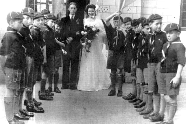 The 54th forming a guard of honour at the wedding of cub mistress Gladwys Alden and Ronald Russell in 1948.
The flag bearer next to the bride is John Clubley.