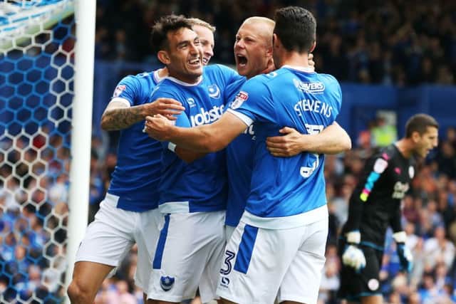 Gary Roberts and Curtis Main celebrate with Carl Baker and Enda Stevens during the Crawley demolition. Picture: Joe Pepler