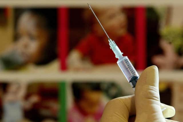 09/08/2004 PA File photo of a nurse handling a syringe at a medical centre in Ashford, Kent, similar to those used for a combined jab for babies. The vaccination protects children against Diptheria, Tetanus, Whooping Cough, Hib and Polio and is administered to babies over two-months-old later this year. See PA FAMILY Family Column. Picture credit to read: Gareth Fuller/PA Photos. WARNING: This picture must only be used to accompany PA Feature FAMILY Family Column. ENGSUS00320120123095607