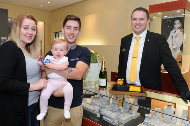 Shaun and Jessica Clark with their daughter Ivy and Goldsmiths branch manager Jon Mondey Picture: Sarah Standing (161251-5832)