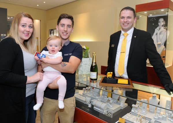 Shaun and Jessica Clark with their daughter Ivy and Goldsmiths branch manager Jon Mondey 

Picture: Sarah Standing (161251-5832)