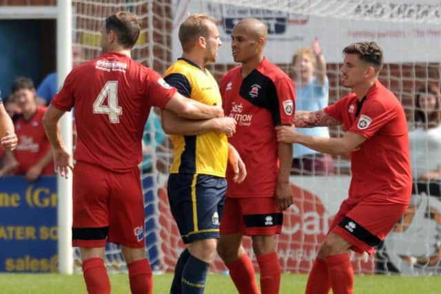 Gosport Borough midfielder Mike Carter, centre Picture: Mick Young