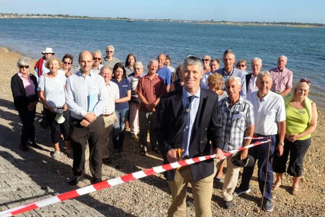 Richard Craven, harbour master and director of Chichester Harbour Conservancy, cuts the ribbon to celebrate the completion of the last stage by the Friends of Nore Barn Woods
Picture: Sarah Standing (161258-6439)