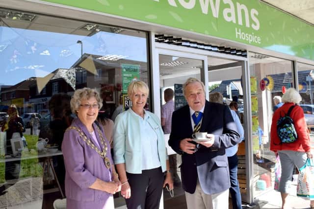 From left, Mayor of Fareham Councillor Connie Hockley, The Rowans Hospice's director of retail Carol Milner and Hampshire county councillor and mayor's consort Geoff Hockley outside the new Rowans Hospice store in Stubbington Green Picture: Loughlan Campbell