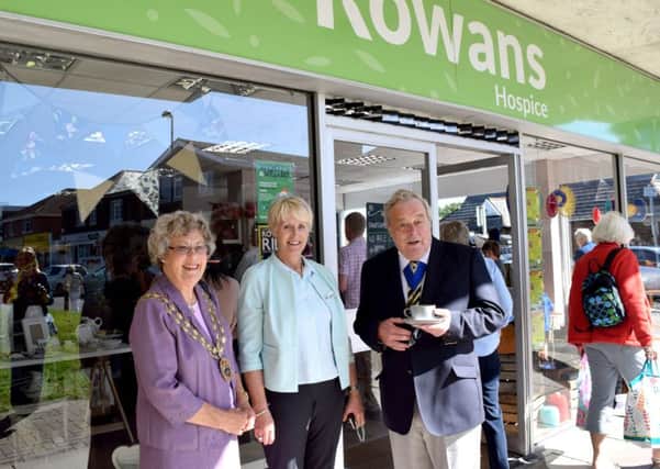 From left, Mayor of Fareham Councillor Connie Hockley, The Rowans Hospice's director of retail Carol Milner and Hampshire county councillor and mayor's consort Geoff Hockley outside the new Rowans Hospice store in Stubbington Green 

Picture: Loughlan Campbell
