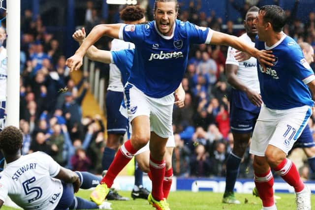 Christian Burgess celebrates his goal in Pompey's 4-2 win against Wycombe Picture: Joe Pepler