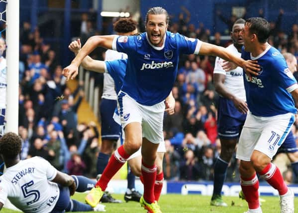 Christian Burgess celebrates his goal in Pompey's 4-2 win against Wycombe Picture: Joe Pepler