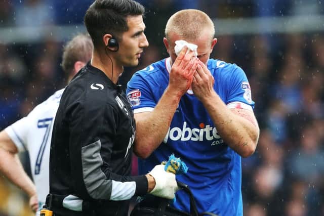 Curtis Main goes off to receive treatment on Saturday Picture: Joe Pepler