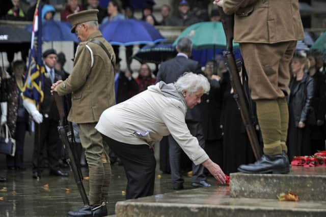 A wreath is laid at the Guildhall Square Cenotaph by Pat Hill, a relative of George Jakes, the youngest soldier from Portsmouth to die in the Battle of the Somme Picture Ian Hargreaves (161221-4)
