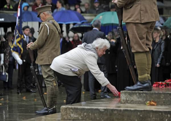 A wreath is laid at the Guildhall Square Cenotaph by Pat Hill, a relative of George Jakes, the youngest soldier from Portsmouth to die in the Battle of the Somme Picture Ian Hargreaves (161221-4)