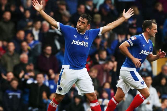 Gary Roberts celebrates his goal in front of the Fratton End Picture: Joe Pepler