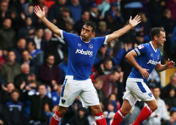 Gary Roberts celebrates his goal in front of the Fratton End Picture: Joe Pepler