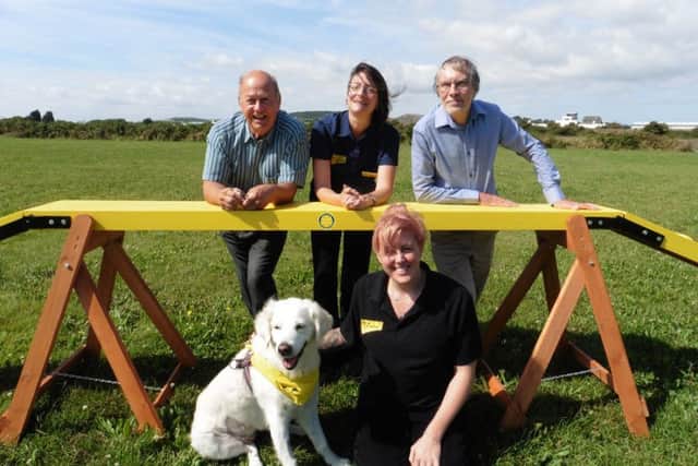Malcom Dent and Simon Mason from Gosport Rotary Club with staff from Shoreham Dogs Trust