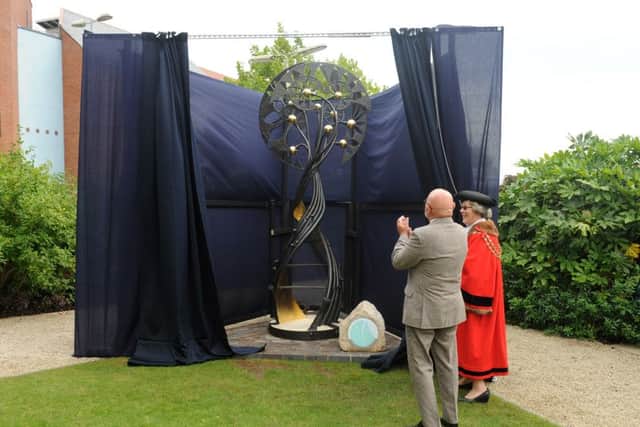 The sculpture being unveiled in the grounds of Westbury Manor Museum.Picture: Sarah Standing (161278-6906)