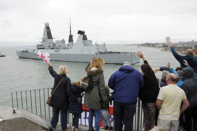 Several hundred families and friends waved off HMS Daring on September 2 as she left Portsmouth for nine months in the Gulf Picture: Malcolm Wells (160902-4642)