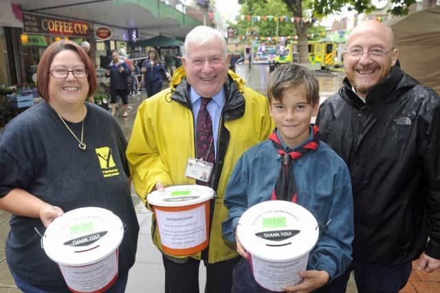 Donna Field of Youth Services, with Councillor Roger Price and Councillor Shaun Cunningham, right, and Stanley Craig, 11, of the 2nd Portchester Scout Group Picture: Ian Hargreaves (161222-2)
