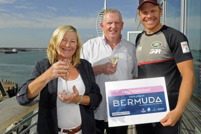 Pat and Nigel Jackson celebrate with Freddie Carr of Ben Ainslie Racing after they won a trip to Bermuda Picture Ian Hargreaves (161227-2)