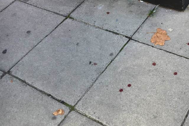 Forensics and blood outside Kensington Hair in Highland Road, Southsea, on September 13.   Picture: Ben Fishwick