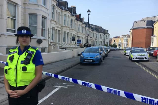 A police officer stands guard at the cordon in Alhambra Road, Southsea, after an incident