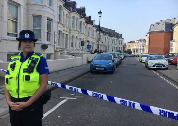 A police officer stands guard at the cordon in Alhambra Road, Southsea, after an incident