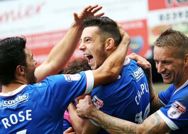 Conor Chaplin is congratulated by his team-mates follwoing his goal against Wycombe last Saturday Picture: Joe Pepler