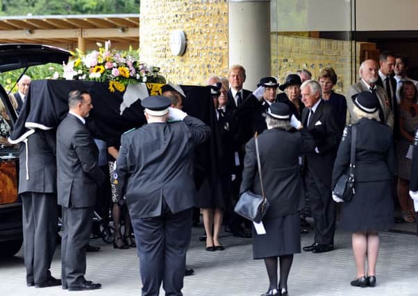 The coffin of Brenda 'Penny' Moss, a former Mayor of Havant, is taken into The Oaks crematorium Picture: Malcolm Wells (160915-0528)