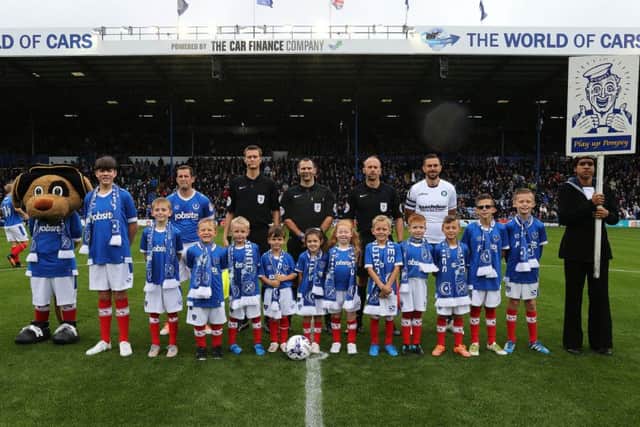 Pompey mascots pose with Blues skipper Michael Doyle ahead of the Wycombe clash. Picture: Joe Pepler