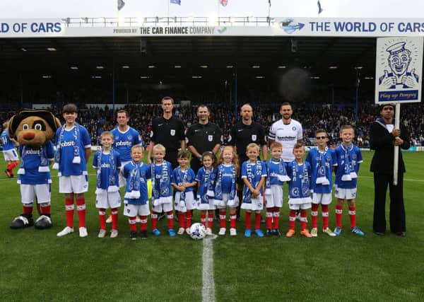 Pompey mascots pose with Blues skipper Michael Doyle ahead of the Wycombe clash. Picture: Joe Pepler