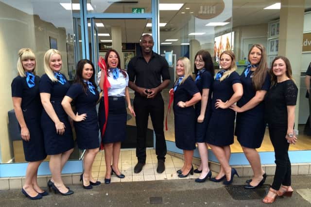 Vincent Pericard with the staff of Thomson in North End, which has undergone a refurbishment Picture: Laura Allen