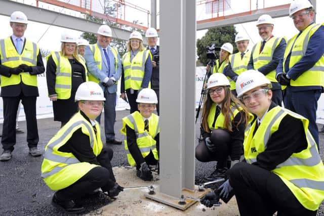Pupils (front, left to right) Leona Howard, Oliver Byng, Kara Collis and Callum Wolfe with (back) Portsmouth City Council leader Councillor Donna Jones, Portsmouth North MP Penny Mordaunt, senior staff from Kier Construction and representatives from King Richard School and the Education Funding Agency