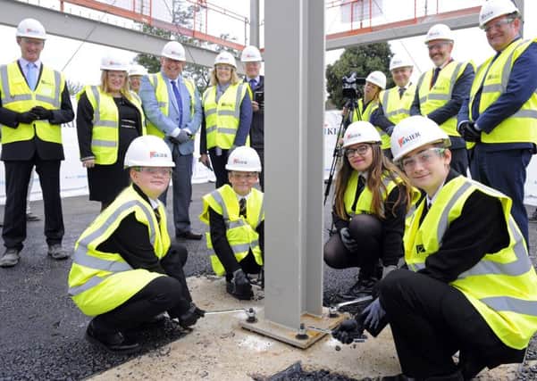 Pupils (front, left to right) Leona Howard, Oliver Byng, Kara Collis and Callum Wolfe with (back) Portsmouth City Council leader Councillor Donna Jones, Portsmouth North MP Penny Mordaunt, senior staff from Kier Construction and representatives from King Richard School and the Education Funding Agency