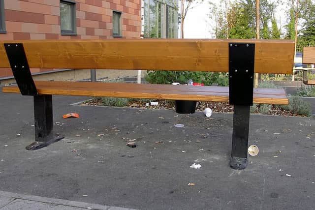 Cigarette butts litter the floor outside one of the Queen Alexandra Hospital entrances  Picture: David Lee