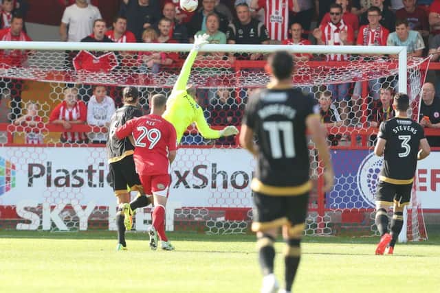 Paddy Lacey beats David Forde from 30 yards to earn victory for Accrington Picture: Joe Pepler
