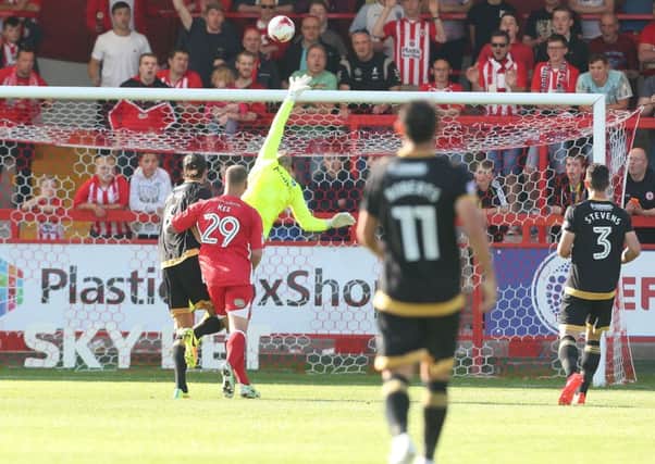 Paddy Lacey beats David Forde from 30 yards to earn victory for Accrington Picture: Joe Pepler