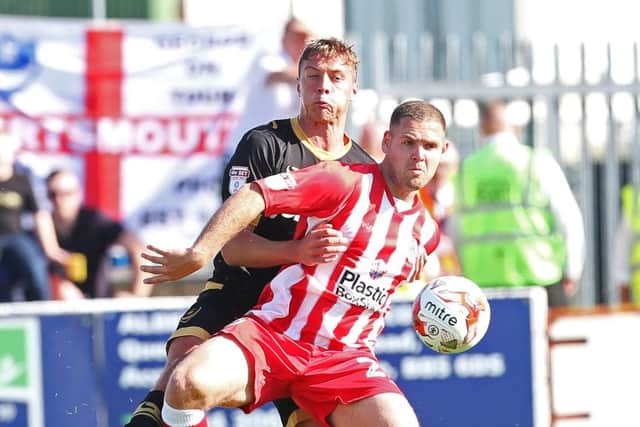 Tom Davies competes for the ball with Billy Kee Picture: Joe Pepler