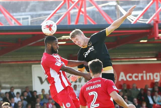Michael Smith challenges for the ball against Accrington. Picture: Joe Pepler