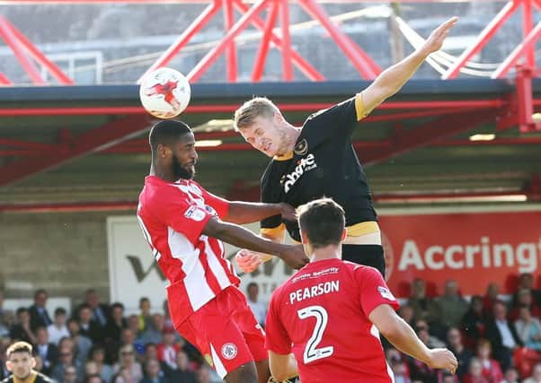 Michael Smith challenges for the ball against Accrington. Picture: Joe Pepler